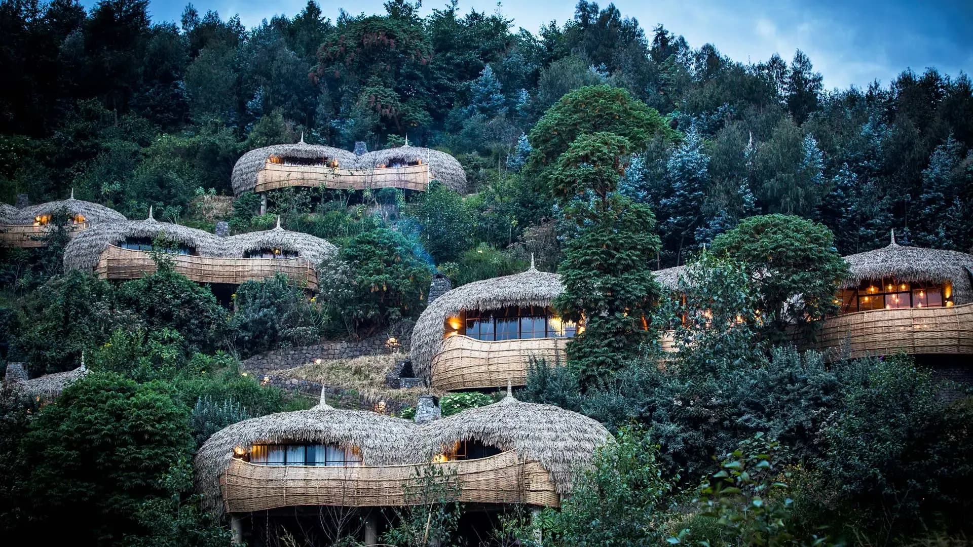 Thatched guest pods at Bisate Lodge below the Virunga volcanoes